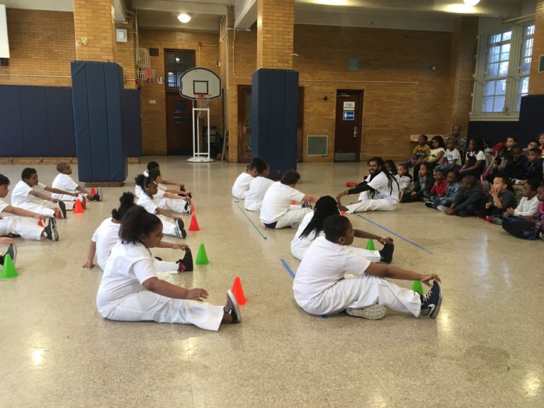 Pena leading a class in stretches at PS 67