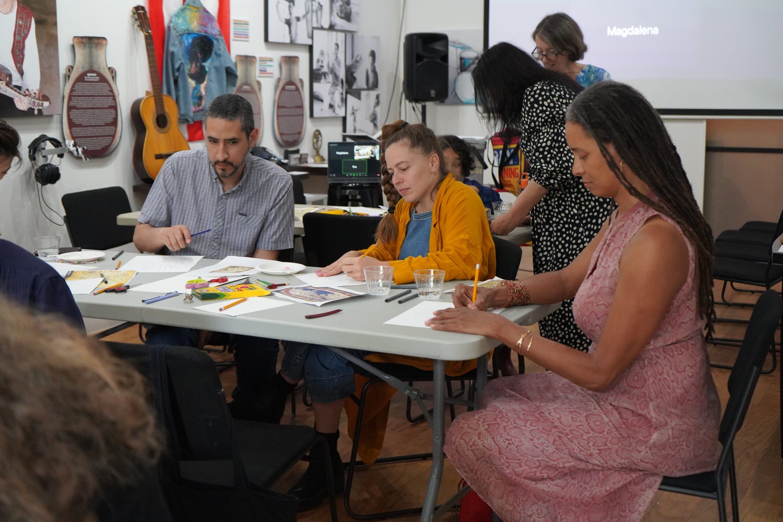 Teaching artists and Mentors Hector Morales, Libby Mislan, and Dionne Kamara participate in hand-map making workshop led by teaching artist Haifa Bint-Kadi, 2023
