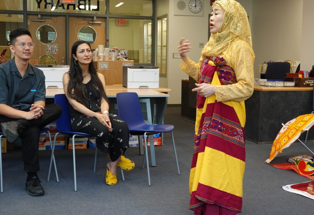 Dancer and Choreographer Potri Ranka Manis shares her story with teachers as part of an interview activity led by teaching artist Karl Orozco.
