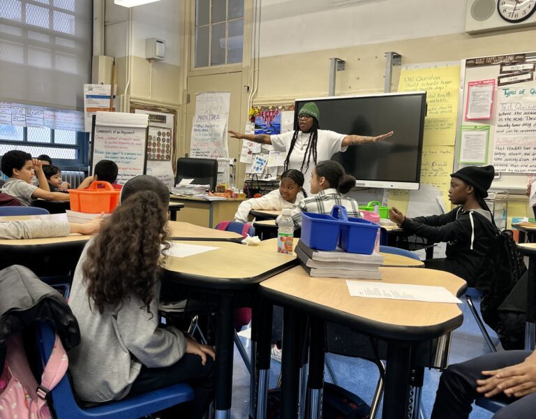 Roya Marsh presenting the culmination Open Mic rules to students at P.S./M.S. 4 in the Bronx