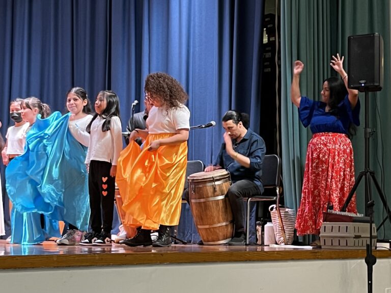 LeAna Lopez and co-teacher Mateo Gonzalez with students at a culminating performance